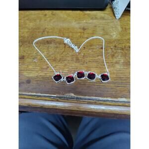 17" silver tone necklace with ruby red stones